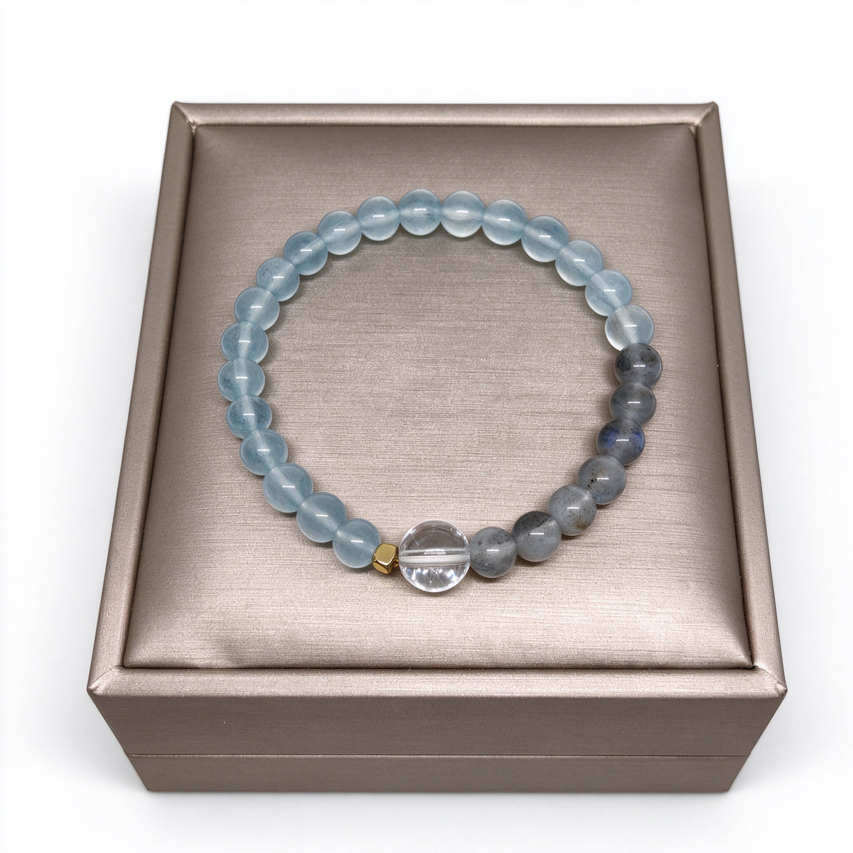 Serenity crystal beaded bracelet displayed on champagne gold satin stand