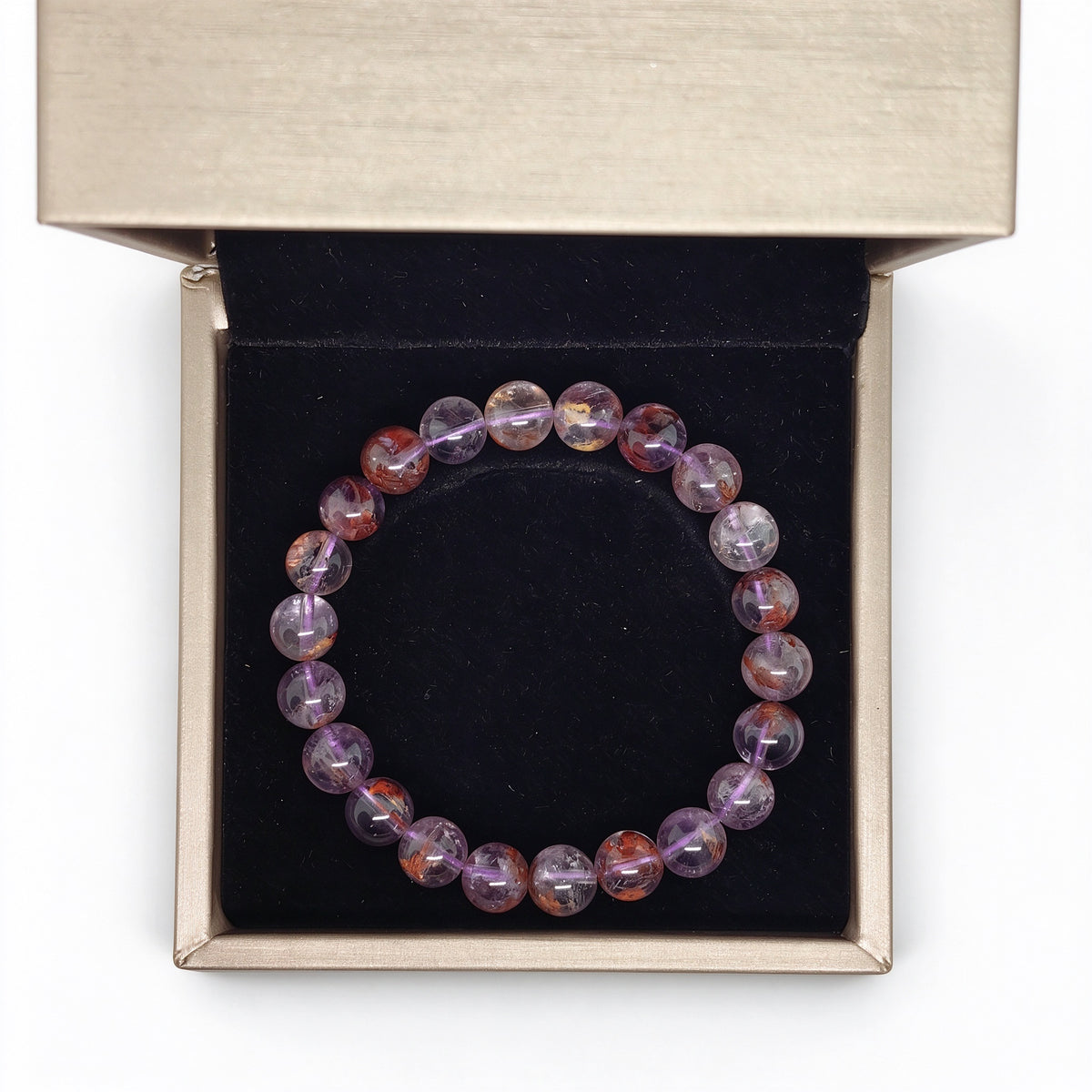 Natural purple phantom quartz beaded bracelet inside luxury gift box with black velvet