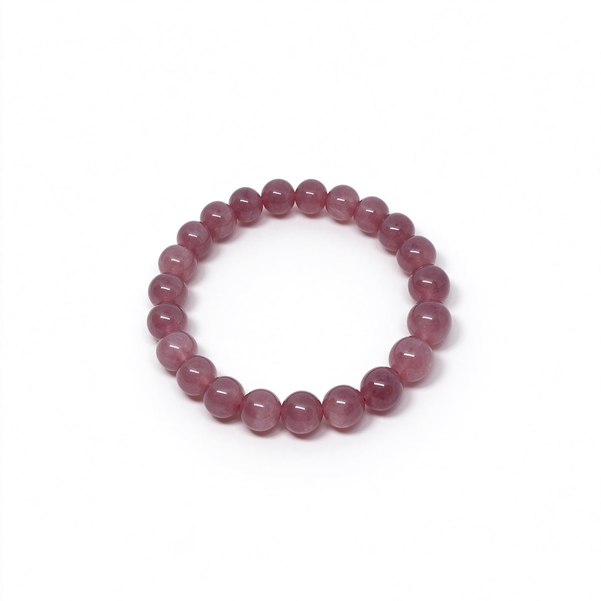 Angled view of translucent Madagascar rose quartz beaded bracelet