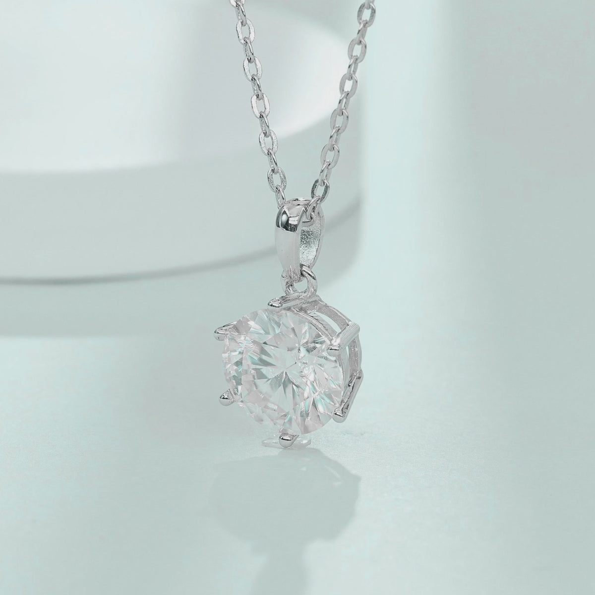 Video showcasing the brilliance and movement of teardrop bail 1.0ct moissanite necklace