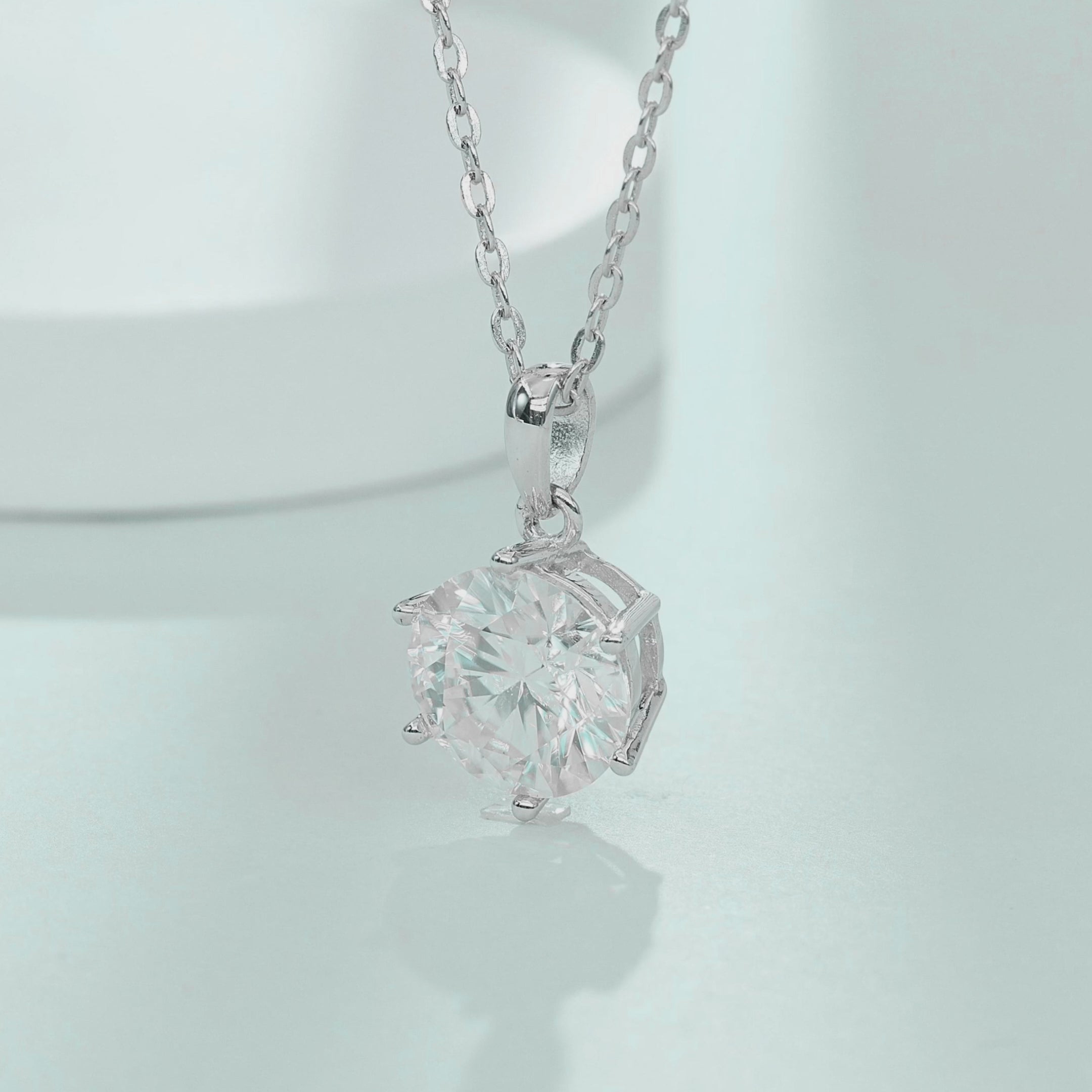 Video showcasing the brilliance and movement of teardrop bail 1.0ct moissanite necklace