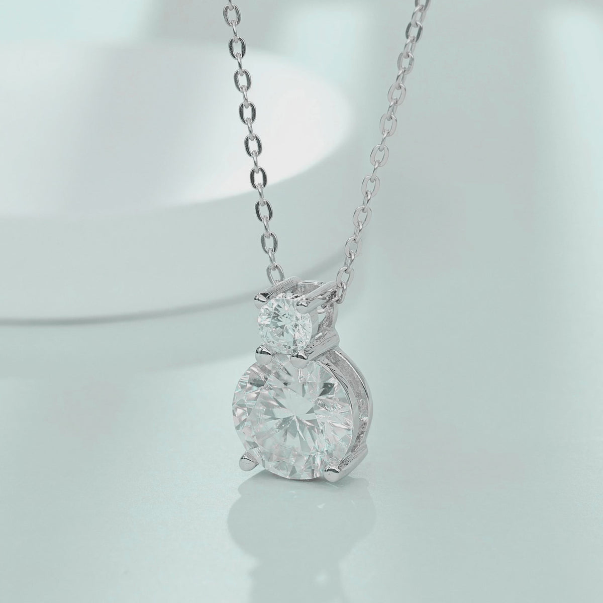 Video showing light reflection and sparkle of 1.1ct tiered two-stone moissanite necklace
