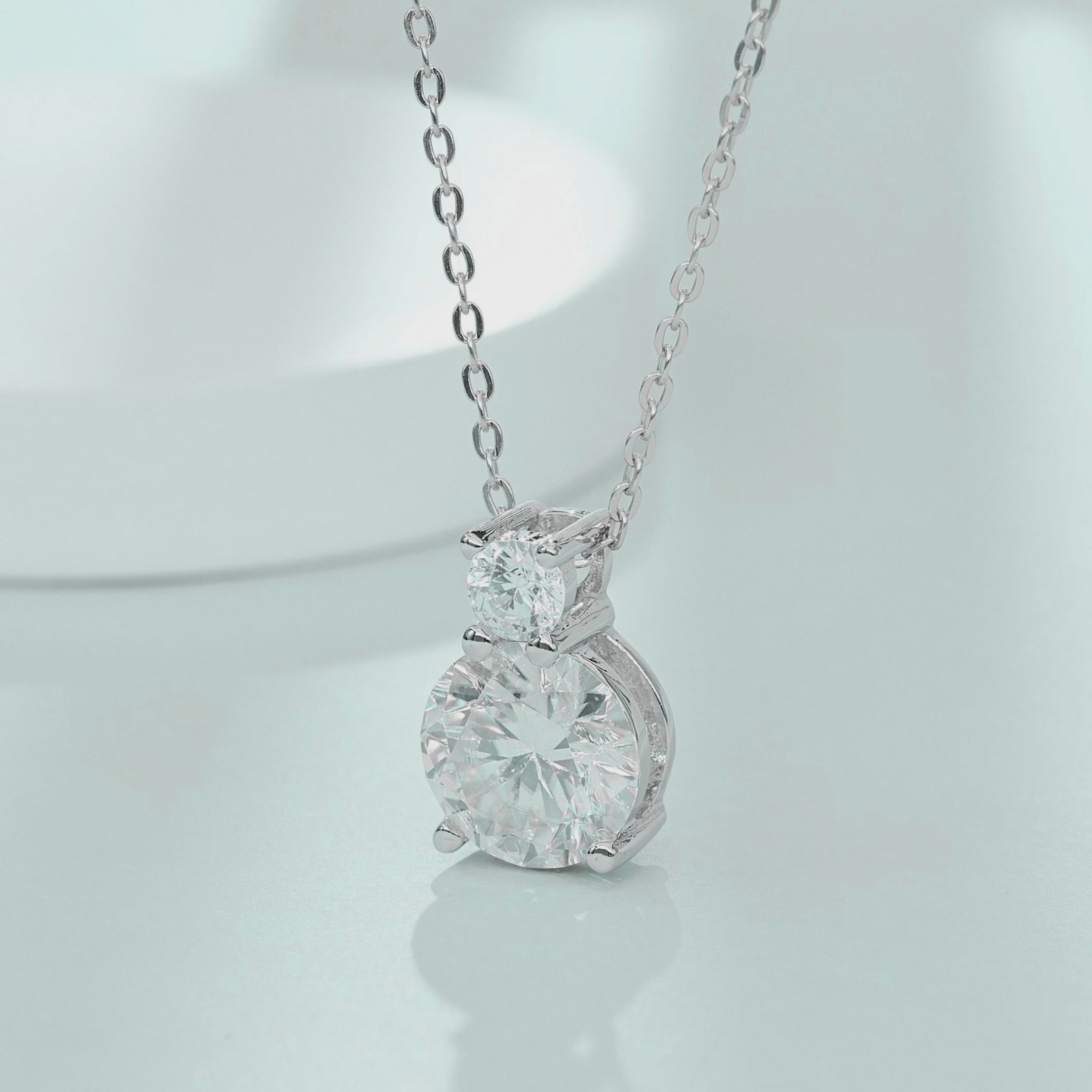 Video showing light reflection and sparkle of 1.1ct tiered two-stone moissanite necklace