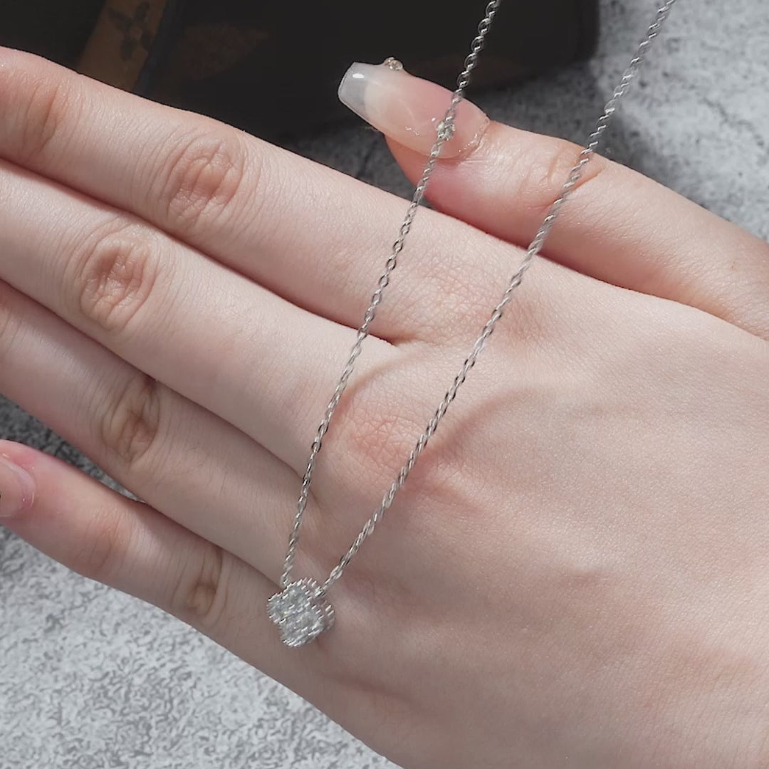 Video highlighting antique-inspired scalloped details and fire of clover moissanite necklace