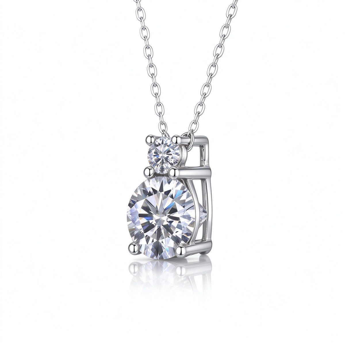 Side profile view of tiered two-stone moissanite drop pendant and basket setting