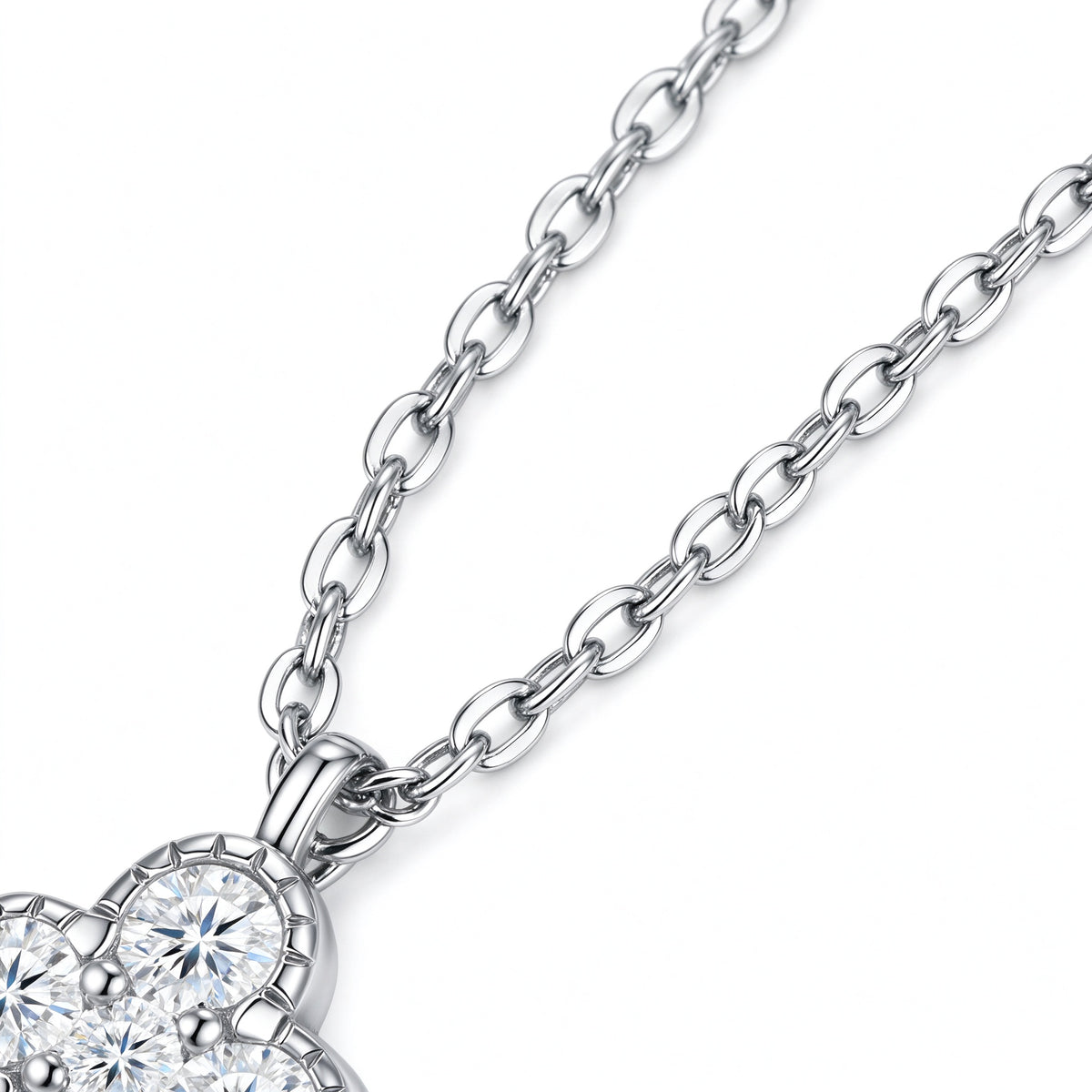 Detail of 925 sterling silver chain connected to vintage clover pendant bail