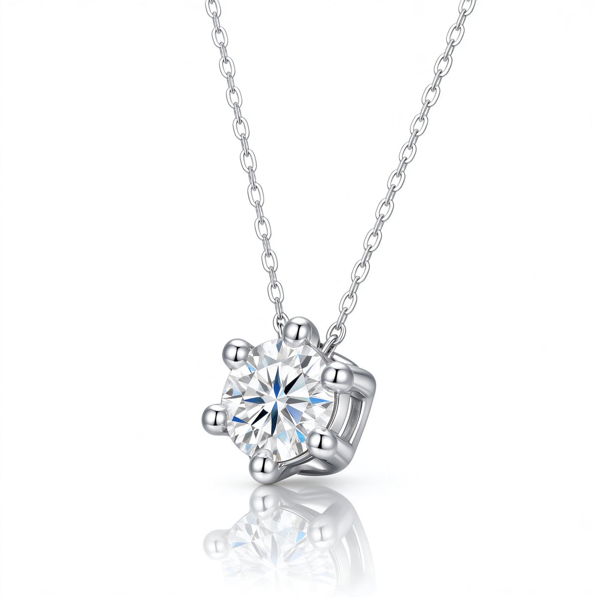 Angled perspective of 1.0ct round moissanite bead-prong necklace on reflective surface
