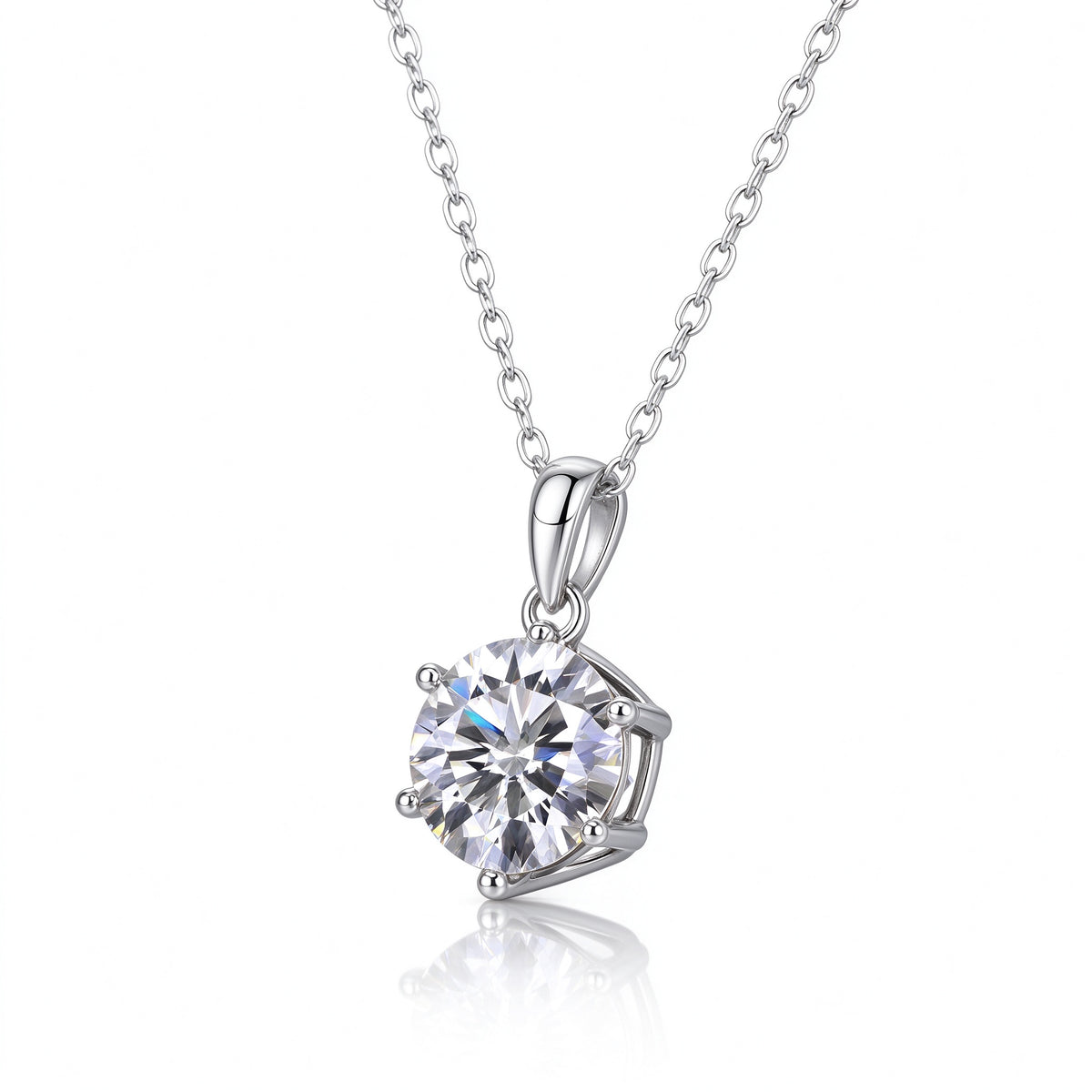 Angled perspective of 1.0ct round moissanite pendant necklace on reflective surface