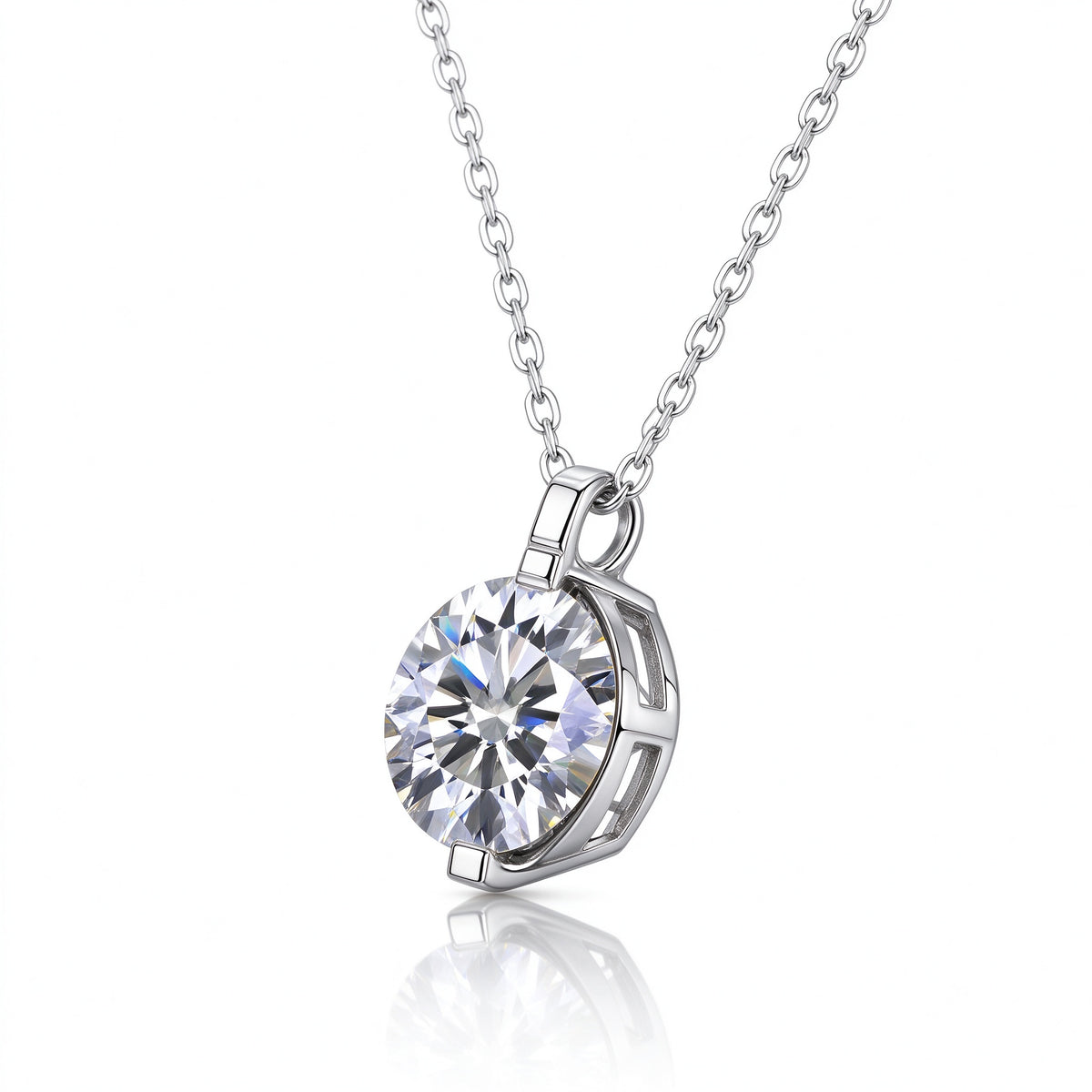 Angled perspective view of 1.0ct round moissanite 2-prong pendant necklace on reflective surface